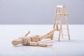 Wooden Figure Lying On Floor Royalty Free Stock Photo