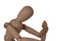 A wooden figure of a man holding his head, sitting in a thoughtful pose, heavy thoughts, anxiety, the problem of choice