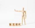 Wooden figure of a man shows stop