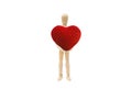 Wooden figure mannequin holding red heart shape isolated on white background. Royalty Free Stock Photo