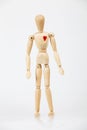 Wooden figure with red heart Royalty Free Stock Photo