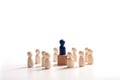 Wooden figure standing on the box for show influence and empowerment. Concept of business leadership for leader team, successful Royalty Free Stock Photo