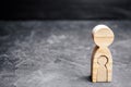 The wooden figure of a woman with a child inside. The concept of pregnancy. Bearing a child. Single mother. Maternal instinct and Royalty Free Stock Photo