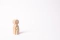 A wooden figure of a woman with a small child inside the body. The concept of a woman`s pregnancy, the bearing of a child Royalty Free Stock Photo