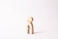 A wooden figure of a woman with a void inside in the shape of a child. The concept of the loss of child, abortion of pregnancy Royalty Free Stock Photo