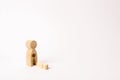 A wooden figure of a woman with a void from which a child fell. The concept of the loss of a child, abortion of pregnancy