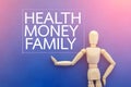 Wooden figure with word of health money and family
