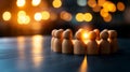 Wooden figures in a circle illuminated by warm bokeh lights at twilight creating unity and connection Royalty Free Stock Photo