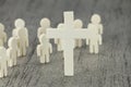 Wooden Figures with cross symbol Royalty Free Stock Photo