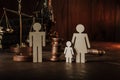 Wooden figures of family with child and gavel on a table. Divorce and alimony concept Royalty Free Stock Photo