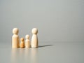 Wooden figures. Family on a gray background. Royalty Free Stock Photo