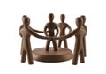 Wooden figures form circle, symbolizing unity and collaboration in business Royalty Free Stock Photo