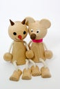 Wooden figures of friends in love sitting