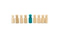 Wooden figures in line as business team, with one blue figure standing out from the crowd, isolated on white background Royalty Free Stock Photo