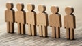 Wooden figures in a line, visual representation of community, diversity, and collaboration in minimalist style