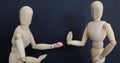 drug pill dealing taking series with wooden manikin figures