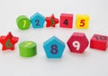 Wooden figures with numbers 1, 2, 3, 4, 5, 6, 7, 8, 9 and 10. Wooden cubes with numbers for children Royalty Free Stock Photo