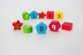 Wooden figures with numbers 1, 2, 3, 4, 5, 6, 7, 8, 9 and 10. Wooden cubes with numbers for children Royalty Free Stock Photo