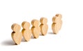 Wooden figures of people stand in the formation. Candidate, elected employee, the best of all. Selection, the choice of talent.