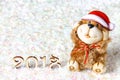 Wooden figures of 2018 on snow. Christmas atmosphere. The new year 2018. A toy dog is a symbol of the New Year. Royalty Free Stock Photo