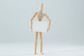 Wooden figurine holding blank placard