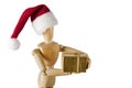 Wooden figurine holding holiday gift