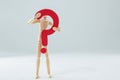 Wooden figurine holding a question mark sign