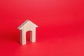 Wooden figurine of a residential building. Minimalism. Affordable housing. Rent of real estate. Realtor services. Repair Royalty Free Stock Photo