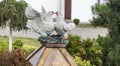 Wooden figurine of two beautiful white doves kissing together