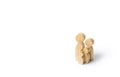 Wooden figurines of the family on a white background. Family values and health. Adoption and custody of children. Social support