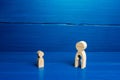 Wooden figurines of a mother with a void and a child. The concept of children leaving their parents. Deprivation of parental