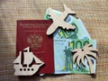 Wooden figurines, Russian passport, Euro banknotes. Concept of traveling and payment. Conflict of Russia and Ukraine