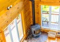 Wooden fireplace in a wooden cottage in forest