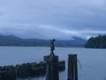 A wooden fisherman watches Davis Bay for dinner