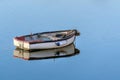 Wooden fishing boat in a calm sea Royalty Free Stock Photo