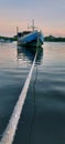 Wooden fishing boat docked in the harbor Royalty Free Stock Photo