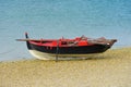 Wooden fishing boat dries up on the seashore Royalty Free Stock Photo