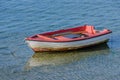 Wooden fishing boat with a motor anchored in the sea Royalty Free Stock Photo