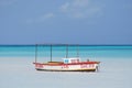 Wooden Fishing Boat off of Palm Beach in Aruba Royalty Free Stock Photo