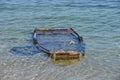 Wooden fishing boat submerged in water