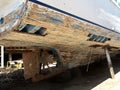 Wooden fishing boat under repair at the dock Royalty Free Stock Photo