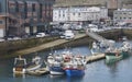 The Wooden Fishing Boats of the Brittany Inshore Fishing Fleet moored up alongside Brest Harbour.