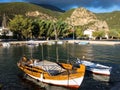 Wooden Fishing Boats in Greek Village Harbour Royalty Free Stock Photo