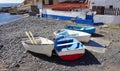 Wooden fishing boats on the pebble seashore in La Caleta village, Tenerife, Canary Islands, Spain