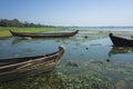 Wooden fishing boats on shore at Taung Tha Man Lake at Amarapura, Mandalay, Myanmar Royalty Free Stock Photo