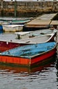 Wooden fishing boats tied to a dock Royalty Free Stock Photo