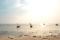 Wooden fishing boats on tropical sea with sunset at seaside chonburi city Royalty Free Stock Photo