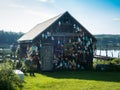 Wooden fishing shack decorated with lobster buoys on a sunny summer day Royalty Free Stock Photo