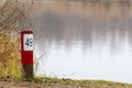 Wooden fishing spot with a plate and the number