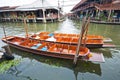 Wooden flat boats in the river at Damoen Saduak floating market